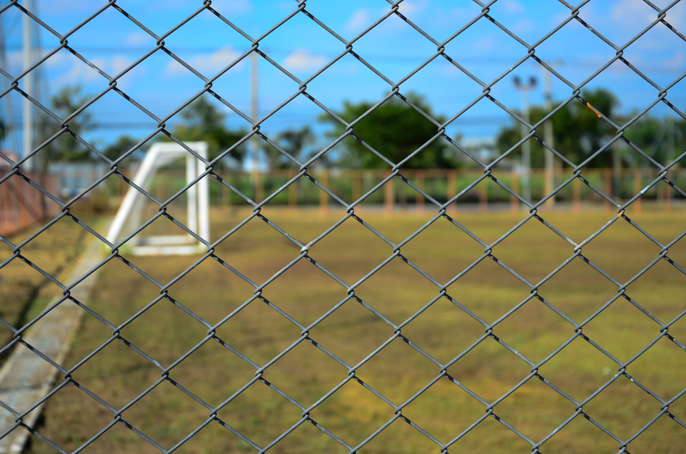 chainwire fence outside a football pitch