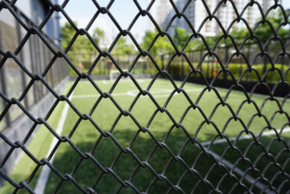 chainwire fencing around a soccer pitch